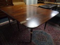 A 19th century mahogany drop leaf table
