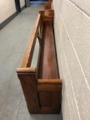 A pitch pine church pew, length 296 cm.