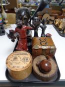 A tray of items including carved wooden tourist pieces, Eastern style jewellery box,