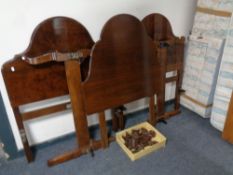 Two sets of Staples 3' bed ends together with a further 3' headboard in mahogany finish