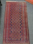 An Afghan rug of geometric design,