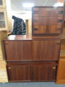 A pair of mid century Danish double sliding door low cupboards together with matching three drawer