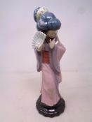A Lladro figure of a geisha holding a fan number 4990