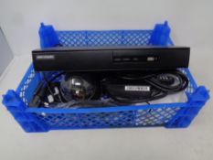 A Hikvision digital video recorder with leads and remotes together with a CCTV eye