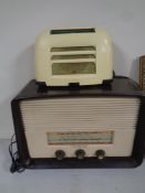 An early 20th century HMV Bakelite cased valve radio together with a further valve radio