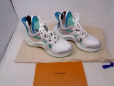 A pair of Louis Vuitton trainers,