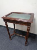 A reproduction mahogany curio table