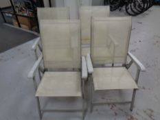 A set of four metal and mesh folding garden chairs