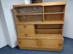 A 20th century bureau display wall unit in a teak finish