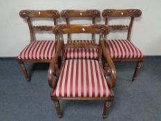 A set of four 19th century mahogany dining chairs comprising of scroll arm armchair and three