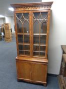 A Chapman's Siesta double door bookcase fitted with cupboards beneath, height 182 cm, width 76.