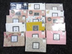 A basket of fifteen Dunelm pillow cases (various,