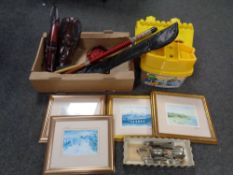 A box containing tribal masks, gilt framed Tom Macdonald print, two piece snooker cue,