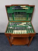A cutlery table containing assorted stainless steel and plated cutlery