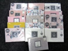 A basket of fifteen Dunelm pillow cases (various,