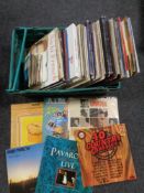 A box containing vinyl LPs and 7 inch singles to include Frank Sinatra compilations, Shirley Bassey,