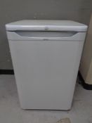 A Indesit under bench fridge