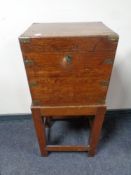 A 19th century mahogany brass bound wine box on stand (12 bottles)