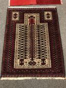 An Afghan prayer rug 131 x 100 cm