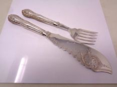 A silver handled fish knife and fork.