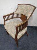 A 19th century inlaid mahogany armchair in floral fabric
