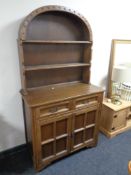 An oak dome topped dresser