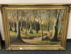 Continental school : a track leading through woodland,