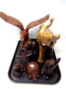 A tray of carved figures, elephant, eagle,