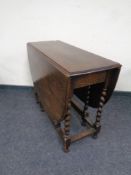 An Edwardian oak gateleg table