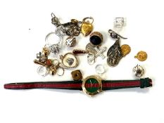 A small quantity of costume jewelry, pendants, wrist watch etc.