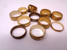 Twelve brass sample wedding bands.