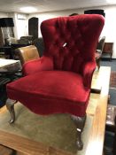 A Victorian style armchair in red fabric