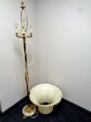 A 20th century brass and alabaster standard lamp on paw feet with shade