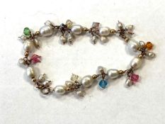 A Pearl and stone set bracelet.