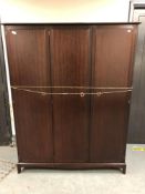 A mahogany triple door Stag wardrobe