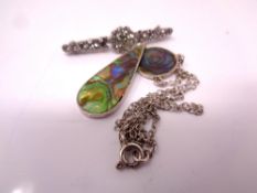 A bar brooch and necklace with pendant.