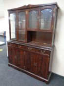 An inlaid mahogany display cabinet