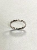 A 9ct white gold diamond half eternity ring, approximately 0.25ct, size L.