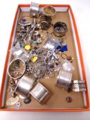 A small quantity of jewelry, napkin rings, white metal and silver items amongst it, bangles,