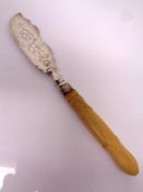 A silver bladed knife.