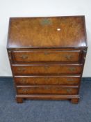 A Regency style presentation writing bureau fitted with four drawers