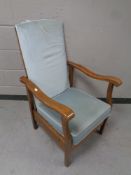 An early twentieth century wooden framed armchair