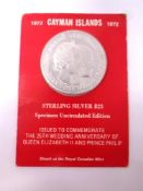 A Cayman Islands sterling silver uncirculated commemorative 25 dollar coin.