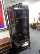 A 20th century Chinese style carved display cabinet (af)
