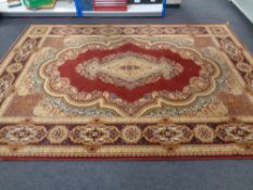 A machined Persian design carpet on gold and red ground with central medallion