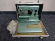 A 20th century Husqvarna automatic electric sewing machine in case (continental wiring)