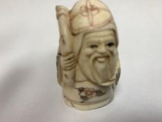 A Japanese bone carving - Village Elder with Staff.