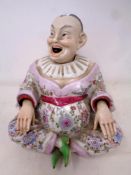A Chinese porcelain nodding head figure, seated gentleman.