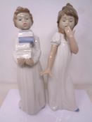 A Nao figure, Boy with books together with a further Nao figure of a girl.