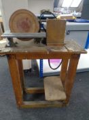 A sanding wheel on table